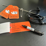 Hunting tags, a pen, and a safety pin for deer hunting Washington