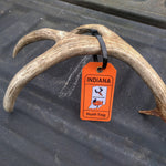 Indiana hunt tag attached to deer antlers with provided reusable zip tie